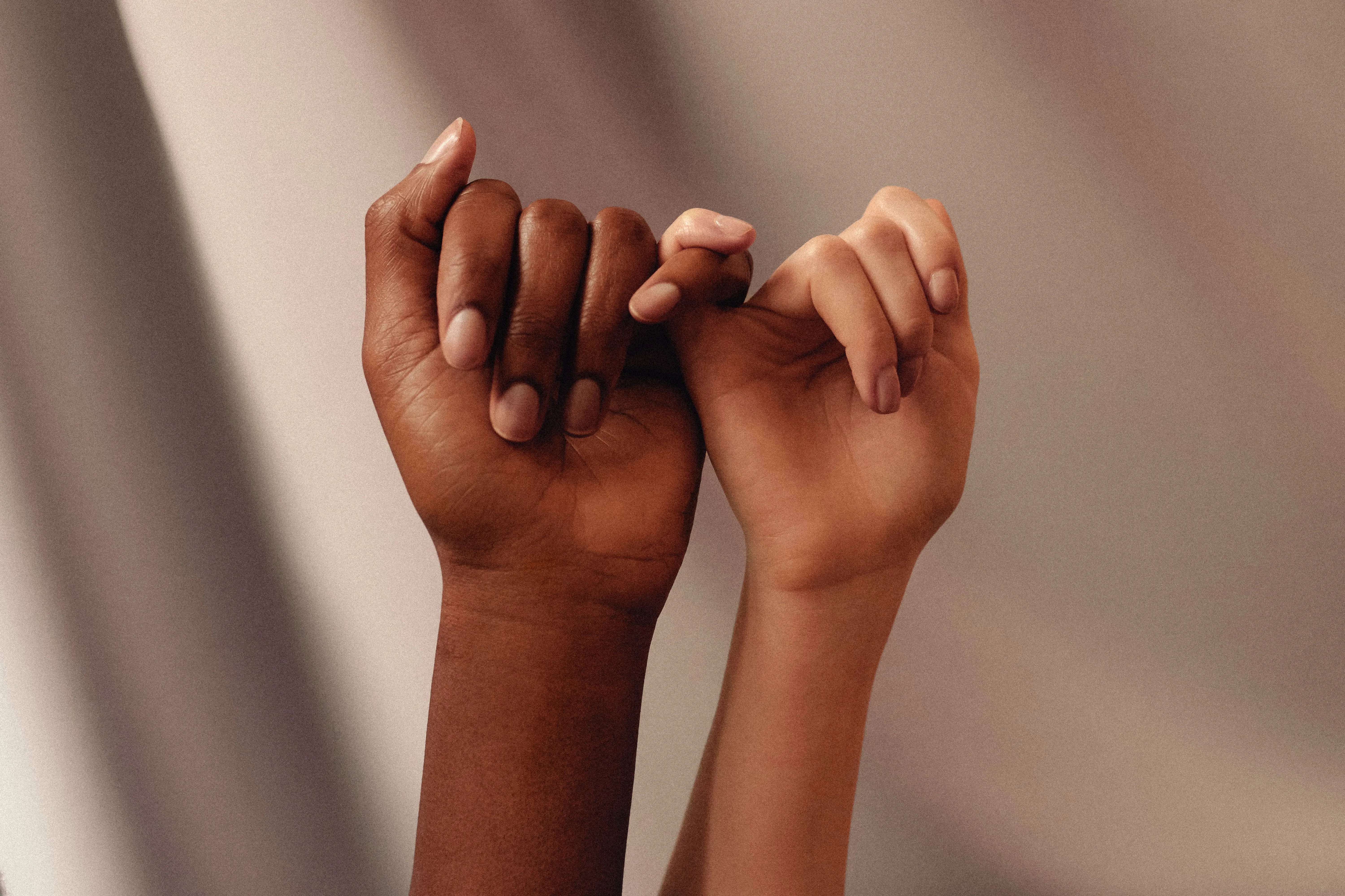 Two hands embracing