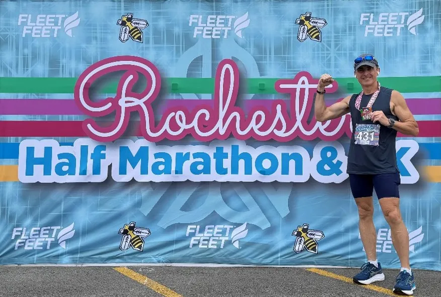Tim Posing with Marathon sign 