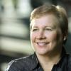 white woman with short hair smiling