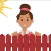 Ruby smiling behind a red fence with the sun shining