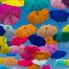 Colorful umbrellas strung up in the sky