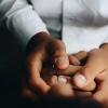 doctor holding patient's hand