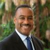 Portrait of board member Dr Dennis Serrette