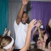 Middleweight boxing champion Daniel Jacobs interacts with a group of children