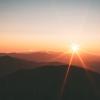 landscape of sunrise over large hills