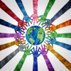 Multi-colored paper cut-outs in the shape of hands are arranged around a blue and green paper cut-out of the Earth