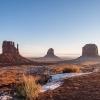 Red sandstone buttes under a blue sky in Monument Valley on the Navajo Nation 