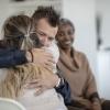 Showing support with a hug in group therapy