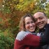 a smiling woman hugging a smiling man, a patient and a caregiver