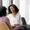 a woman counselor meeting with another woman