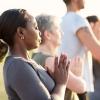 women and men practicing yoga