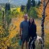 Amber and her husband enjoy the autumn colors on a mountain hike with their dog.