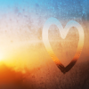 a hand-drawn heart on a window