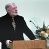 Jerry speaks at a podium