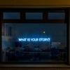 What Is Your Story? display LED lights in office window