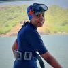 Krashnika wearing scuba diving gear gets ready to dive into water