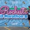 Tim Posing with Marathon sign 